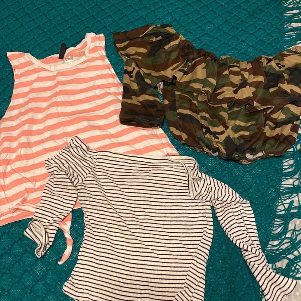 Bundle of three shirt. Between Medium and Large size fit .